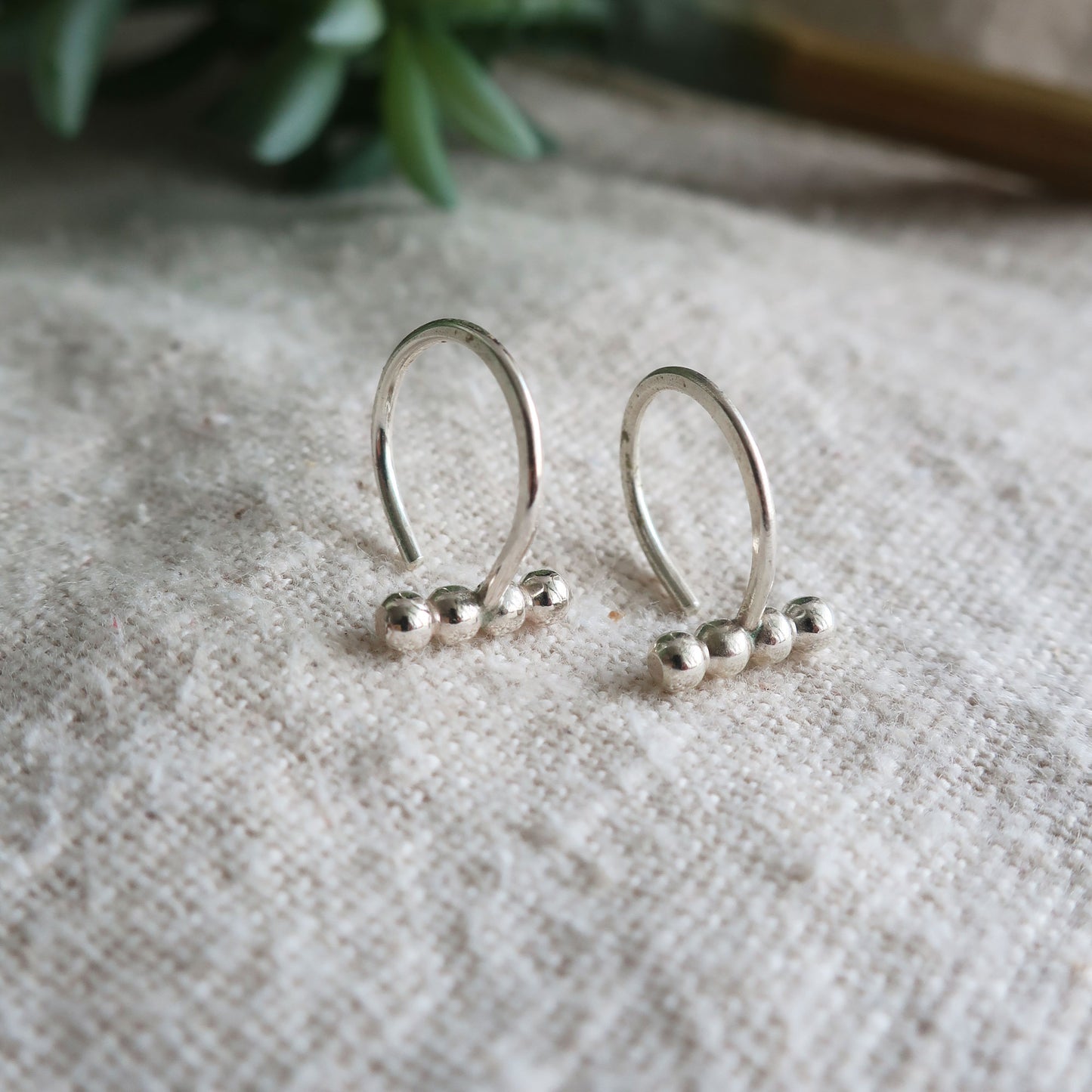 Ellipsis Huggie Earrings
