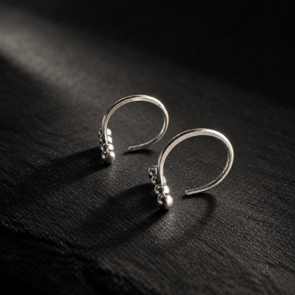 Ellipsis Huggie Earrings