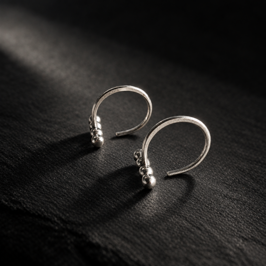 Ellipsis Huggie Earrings