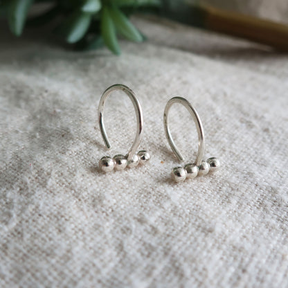 Ellipsis Huggie Earrings